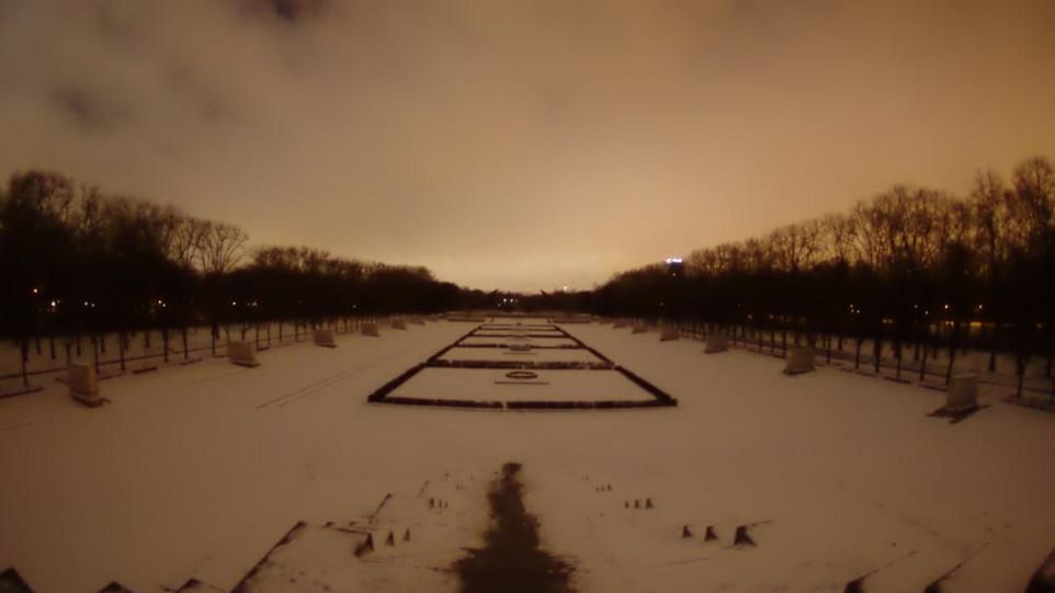 Snowglowing over a park