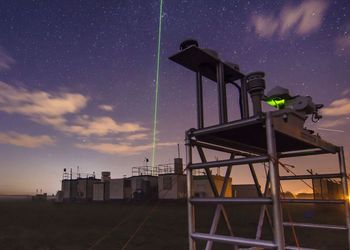 The picture shows a research station by night.
