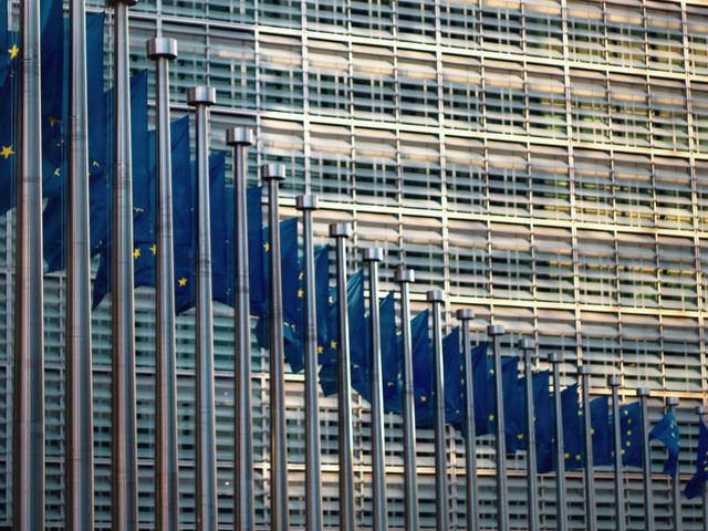 EU flags in front of the Commission in Brussels