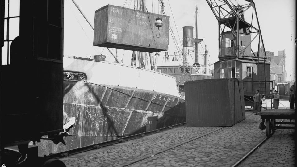 Loading a lift van onto a ship in the port of Hamburg. Black and white photo of the loading of a lift van onto a ship