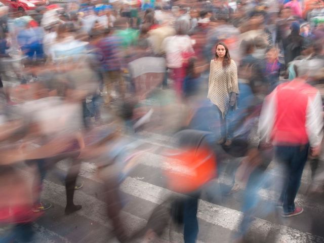 Young woman in a blurred crowd