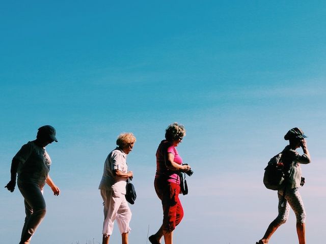 Four elderly people on the move