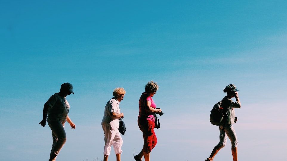 Four elderly people on the move